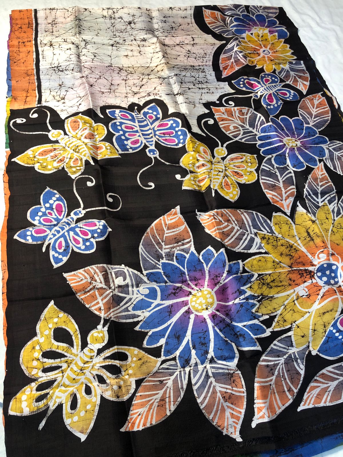 Close-up of hand painted butterfly and floral Momochitro artwork on Murshidabad silk saree