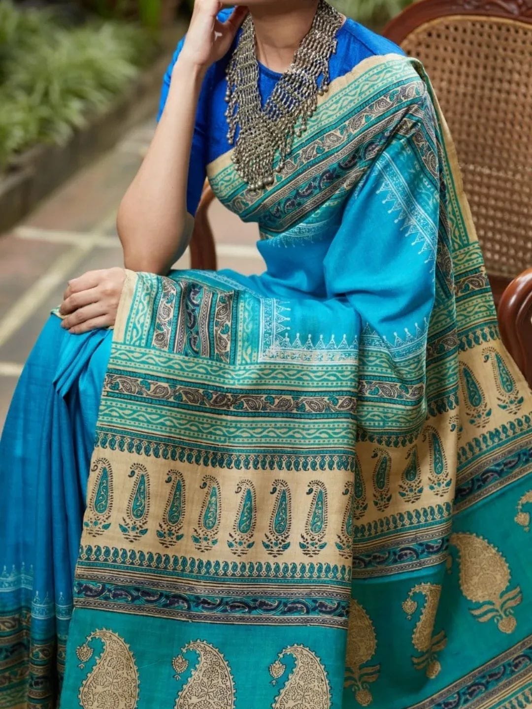 Pure Tussar silk saree in turquoise blue with traditional paisley border and woven design
