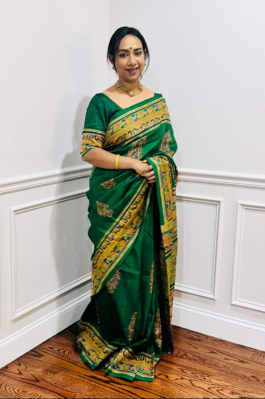 Pure Tussar silk saree in green with traditional golden border and ethnic design