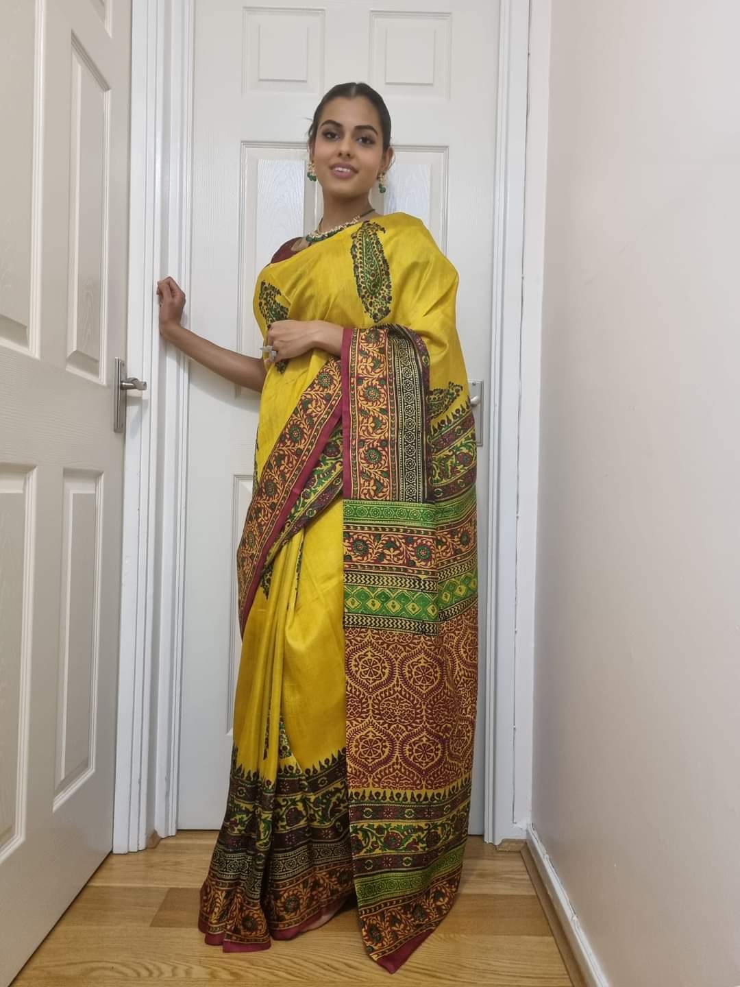 Pure Tussar silk saree in yellow with traditional multicolor border and ethnic design