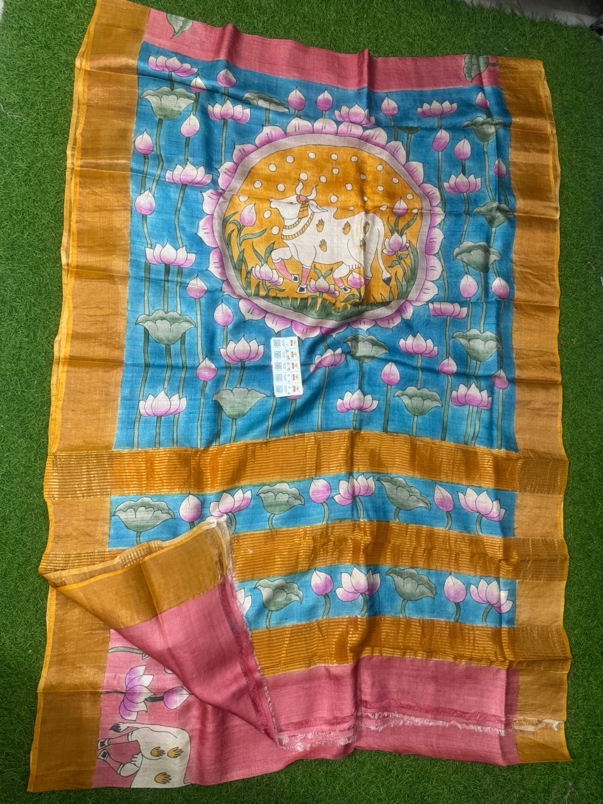Handpainted Tussar silk saree with cow and lotus motif in blue with mustard border and pink pallu