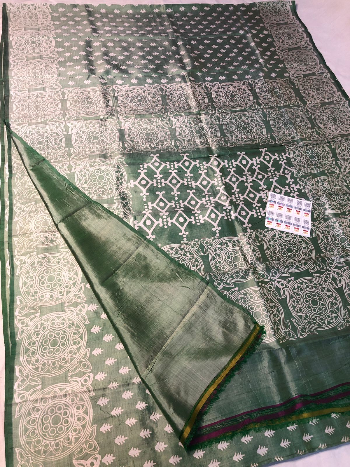 Dual tone green Katan silk saree with white geometric traditional motifs